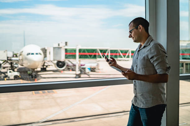 istock Man on airport waiting for a flight 1308844155