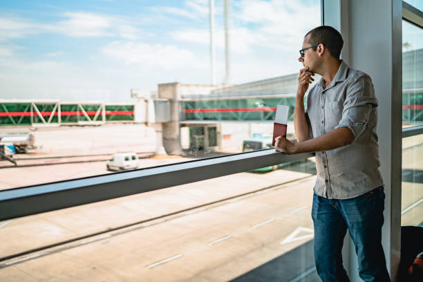 istock Man on airport waiting for a flight 1308844178