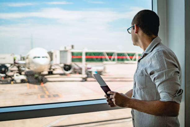 istock Man on airport waiting for a flight 1308844262