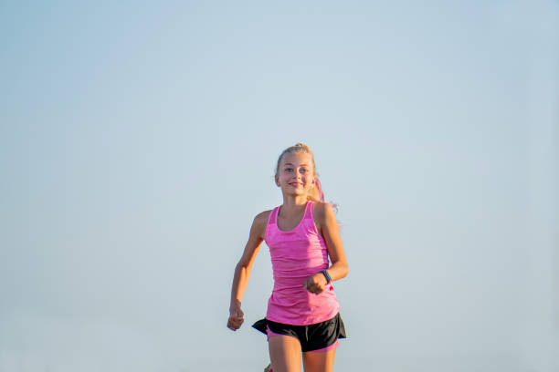 istock Girl runs on a sunny summer evening 1308846511