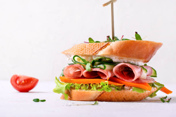 Sandwich with smoked sausage,cheese, vegetables and microgreen