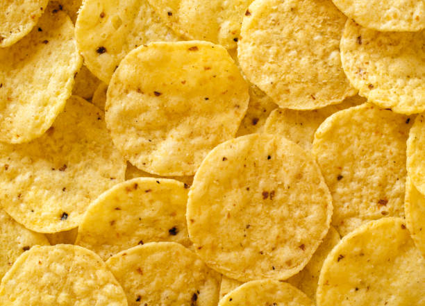 Tortilla Chips Overhead view of tasty tortilla chip rounds tortilla chip stock pictures, royalty-free photos & images