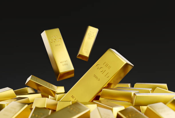 złoto ułożone na czarnym tle. - gold bullion ingot stock market zdjęcia i obrazy z banku zdjęć