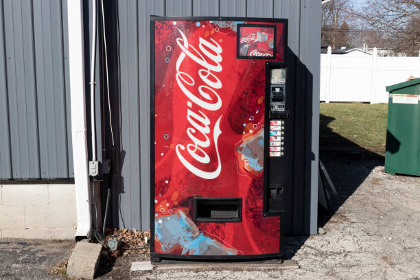 close up of old soda machine money slot