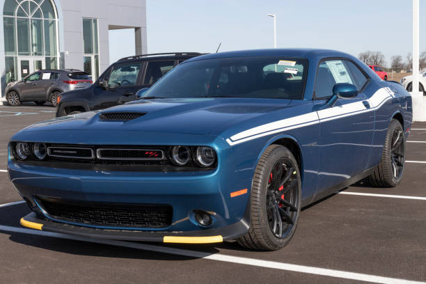 Dodge Challenger display at a Chrysler dealership. The Stellantis subsidiaries of FCA are Chrysler, Dodge, Jeep, and Ram. Tipton - Circa March 2021: Dodge Challenger display at a Chrysler dealership. The Stellantis subsidiaries of FCA are Chrysler, Dodge, Jeep, and Ram. dodge charger stock pictures, royalty-free photos & images