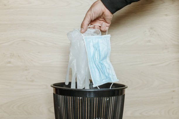istock Used gloves and surgical mask 1308858270