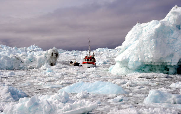 istock Fishing boats on an iceberg 1308859351