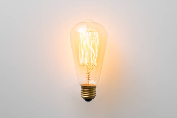 istock vintage light bulb glows without wires on white background 1308861297