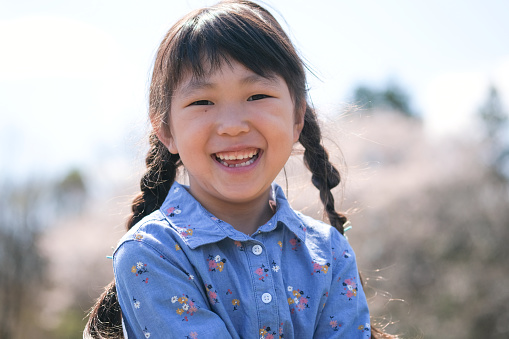 Portrait of little girl in traditional Chinese clothing to celebrate the Chinese New Year