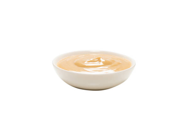 istock Mushroom sauce in a bowl isolated on white background. 1308867749