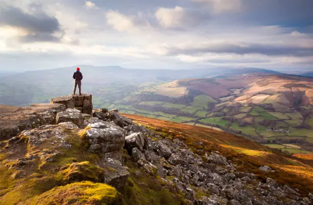 Distant figure against mountain sunset - Brecon Beacons national park, Wales