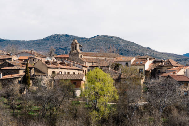 Scenic panoramic view of the the village of Horcajuelo de la Sierra during springtime Scenic panoramic view of the village of Horcajuelo de la Sierra in Madrid during springtime cherry blosson tree stock pictures, royalty-free photos & images
