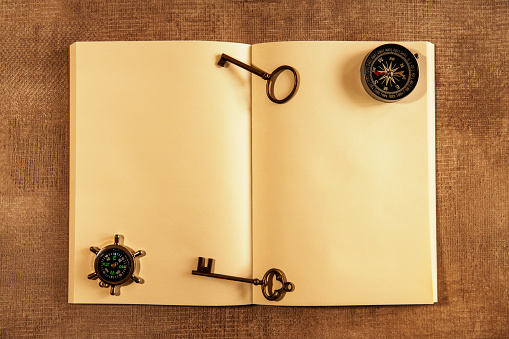 Vintage compass,key and blank notebook