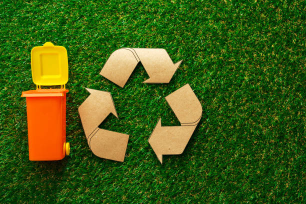 istock Garbage sorting concept with toy waste bin on paper background 1308870790