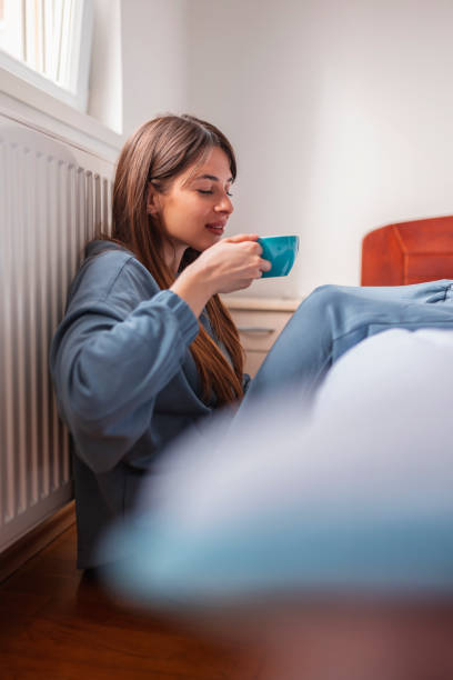 istock Woman drinking morning coffee 1308871743