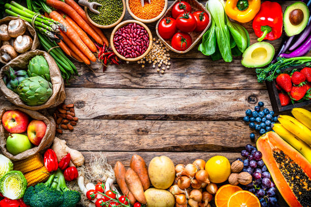 istock Fresh organic fruits, vegetables and legumes frame. Copy space 1308876592