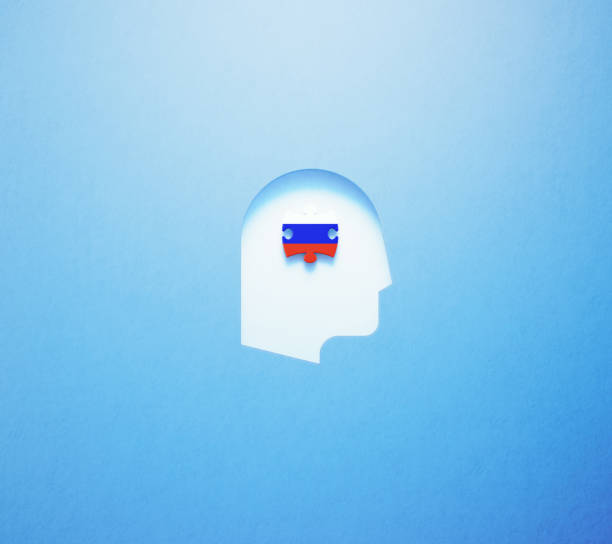 istock Russian Learning And Speaking Concept - Jigsaw Puzzle Piece Textured With Russian Flag Sitting Inside Of A Cut Out Human Head Shape On Blue Background 1308876595