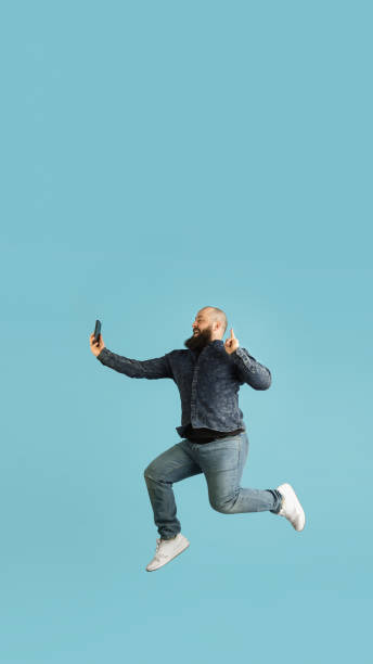 istock Handsome caucasian man portrait isolated on blue studio background with copyspace 1308876773