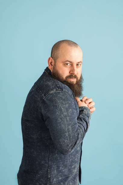 istock Handsome caucasian man portrait isolated on blue studio background with copyspace 1308876791