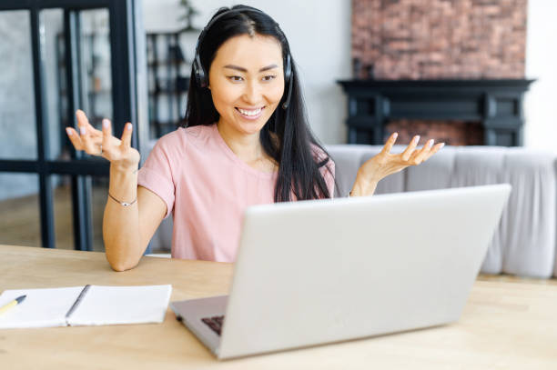 istock An attractive young asian woman using laptop 1308878480
