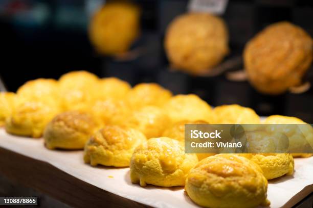 Hong Kong Style Baked Pineapple Bun With Butter In A Bakery Stock Photo - Download Image Now