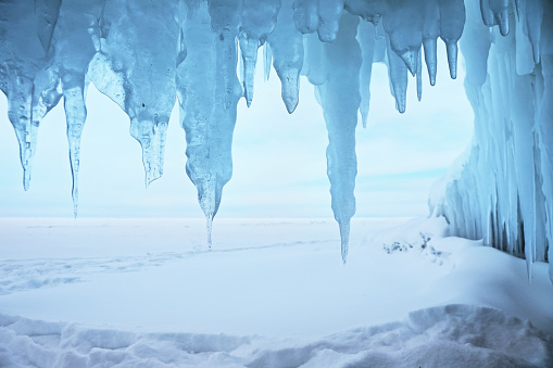 View from frozen grotto to the winter Baikal lake. Siberia, Russia