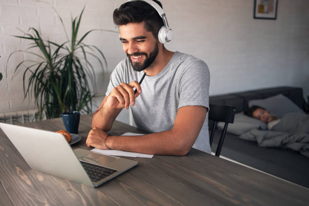 istock Handsome businessman having casual online meeting 1308880307