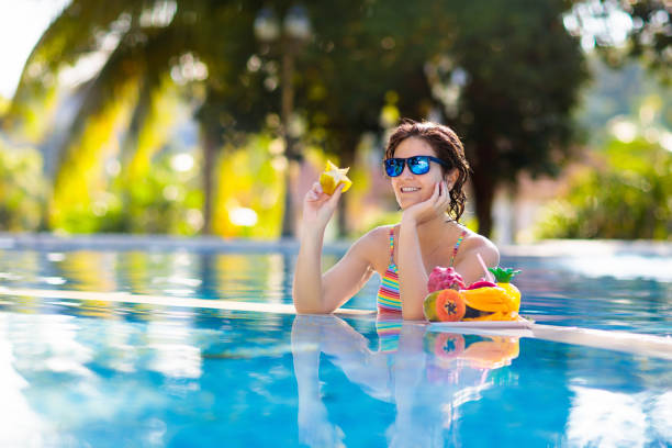 istock Tropical fruit at swimming pool 1308882272