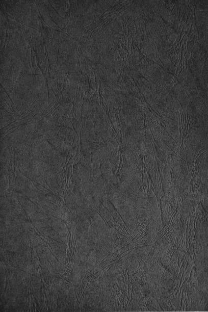 istock Abstract dark gray paper texture with leather-like embossing. 1308882782