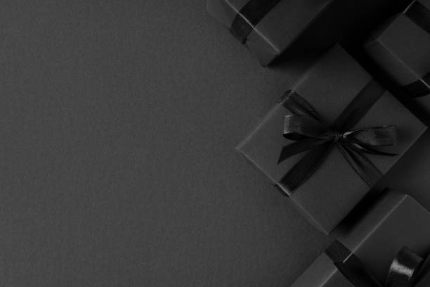 istock Black Gift boxes close up on dark background 1308883335