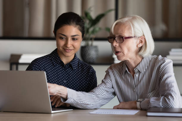 istock Diverse colleagues work online on laptop in office 1308883959