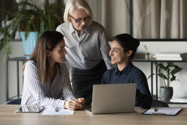 istock Diverse female colleagues brainstorm at office meeting 1308883961
