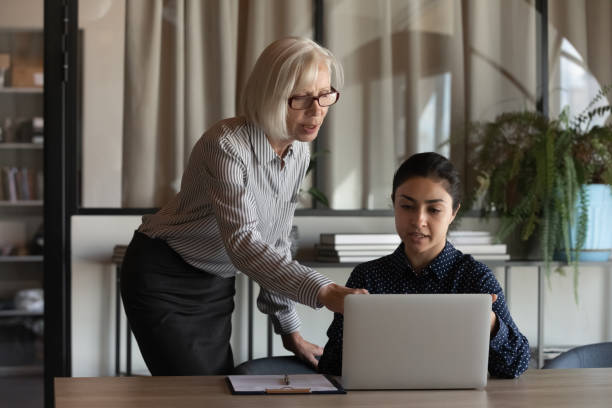 istock Multiracial businesspeople brainstorm working in computer in office 1308883967