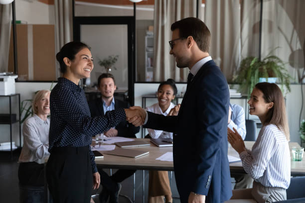 istock Diverse colleagues handshake at business meeting in office 1308884018
