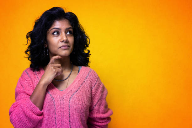istock Beautiful thoughtful indian girl 1308885112