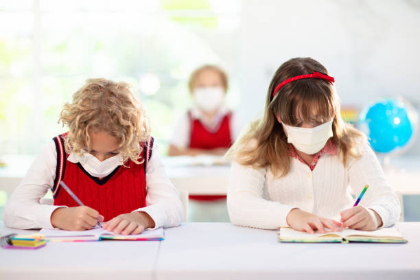 istock Kids in face mask. Child in school. 1308886776