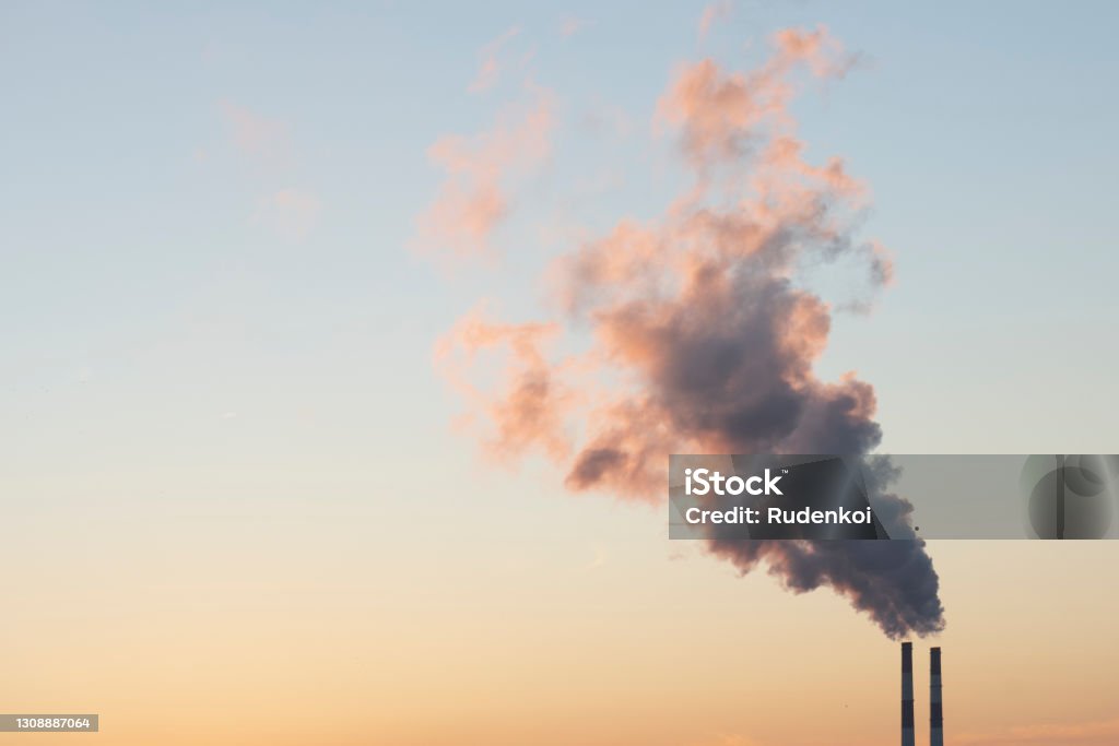 Harmful air pollution. Factory pipes pollute lots of toxic substances Climate Change Stock Photo
