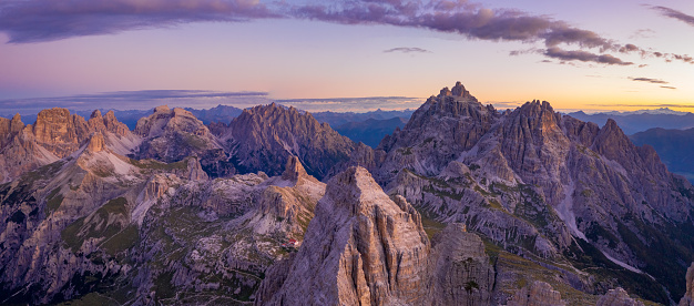 Aerial view of Italian alps. Mountains in sunrise. High resolution panorama.