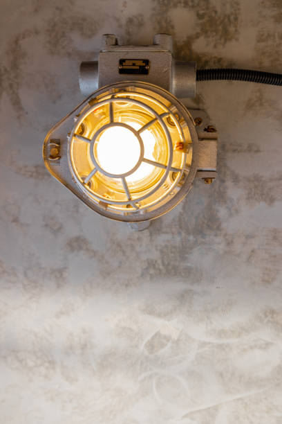 istock Industrial lamp on the concrete ceiling 1308888093
