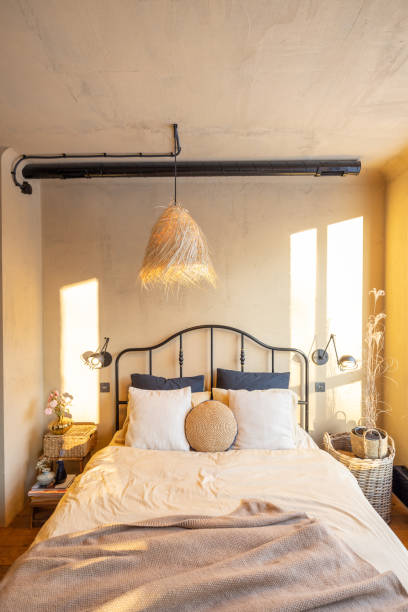 istock Stylish bedroom interior in natural boho style 1308888248