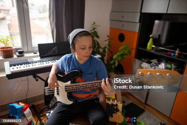 Boy Playing Guitar Stock Photo - Download Image Now - Musician, Teenager, Bass Guitar