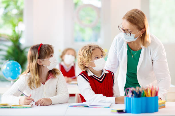 istock Kids in face mask. Child in school. 1308888457