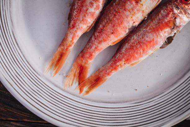 Wash the prepared sea fish for cooking