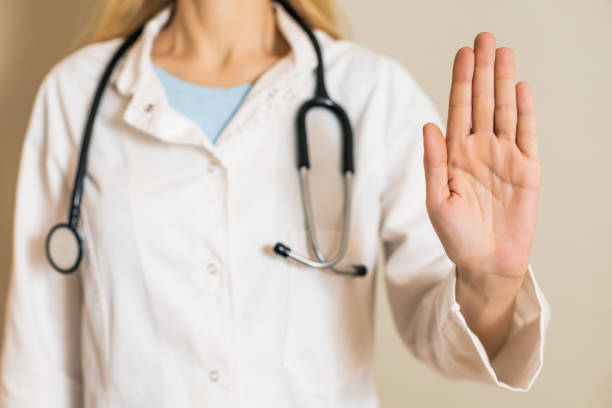 istock Female doctor showing stop sign 1308889882