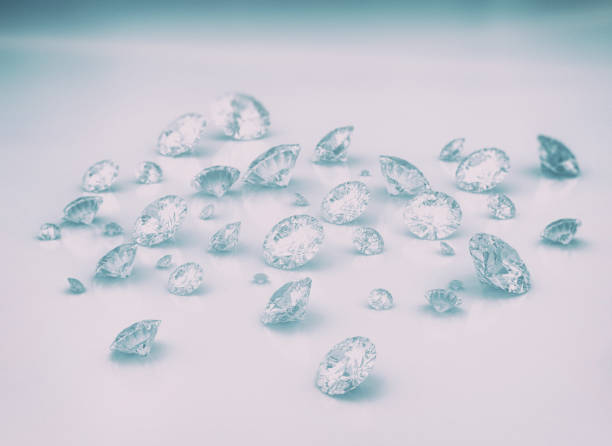 istock Diamonds spread out on glossy white floor, bright light and blue shade. 1308893257