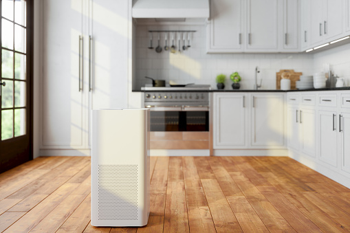 Purificador de aire en cocina moderna para aire fresco, vida saludable, limpieza y eliminación de polvo. photo