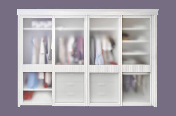 Large modern built-in wardrobe with matte glass on sliding doors isolated on a purple background