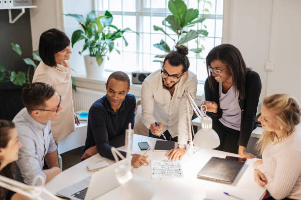 istock Multi ethnic crowdfunding team on business meeting 1308898426