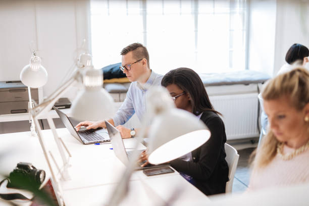 istock Employees working in office after coronavirus is over 1308898654