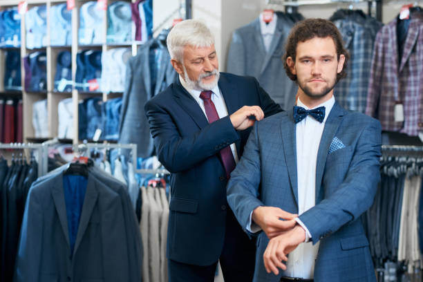 istock Father and son picking up stylish costumes. 1308898708